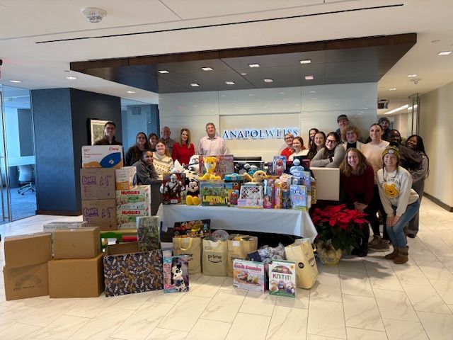 Anapol Weiss law firm staff with bins of donated toys and sensory items for St. Christopher’s Hospital for Children.
