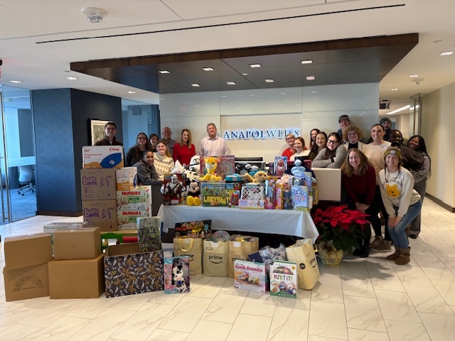 Image Anapol Weiss law firm staff with bins of donated toys and sensory items for St. Christopher’s Hospital for Children.