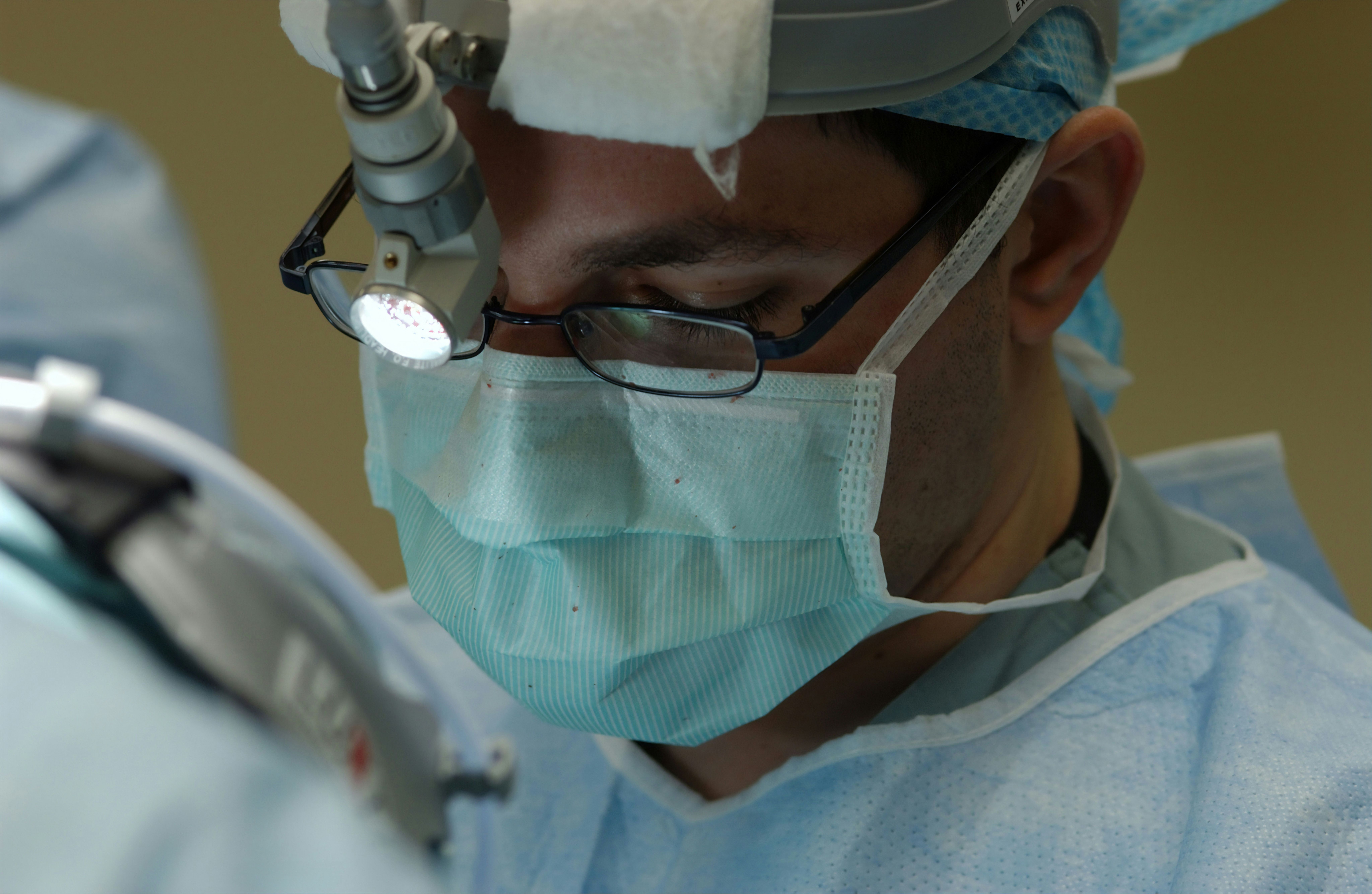 Surgeon performing endoscopic procedure, highlighting infection risks linked to contaminated Olympus medical devices