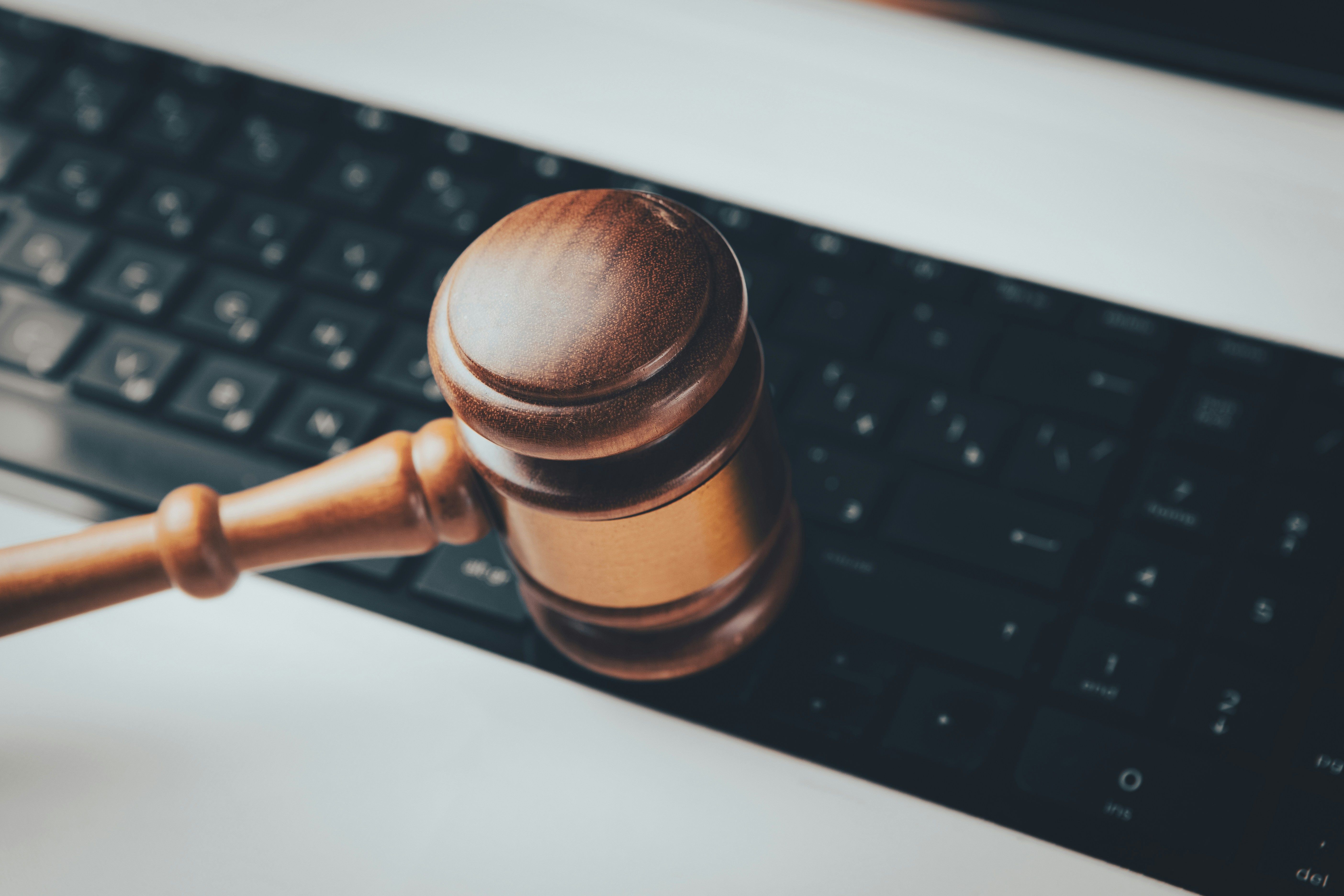 Judge gavel on computer keyboard representing Meta child safety verdict and the growing role of digital platforms in litigation