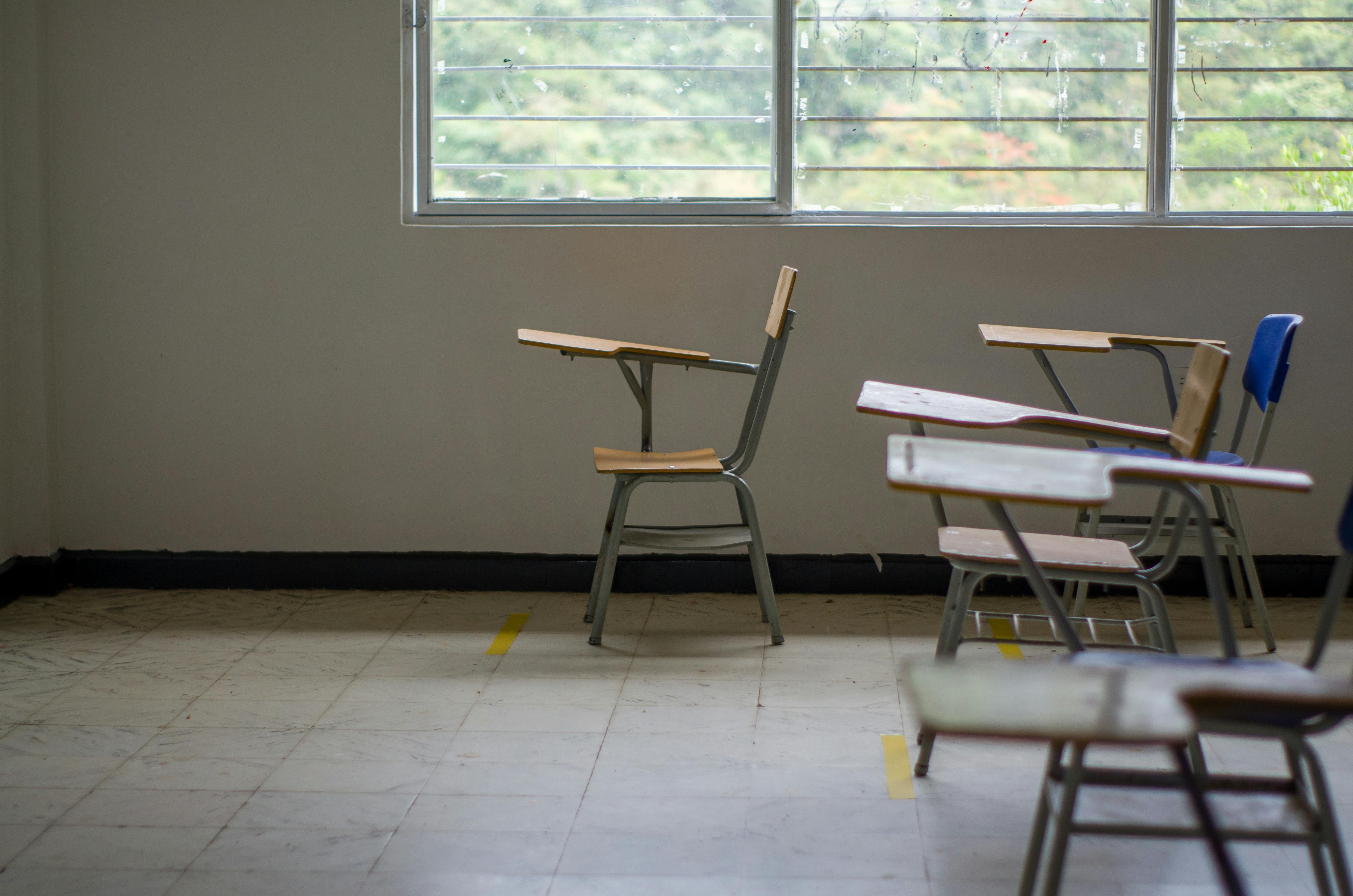 Empty institutional room with chairs, representing missed warning signs and lack of oversight in environments responsible for child safety