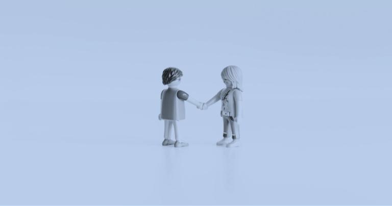 Lego people shaking hands on a closed deal 