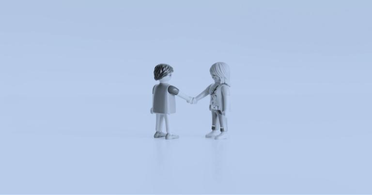 Lego people shaking hands on a closed deal