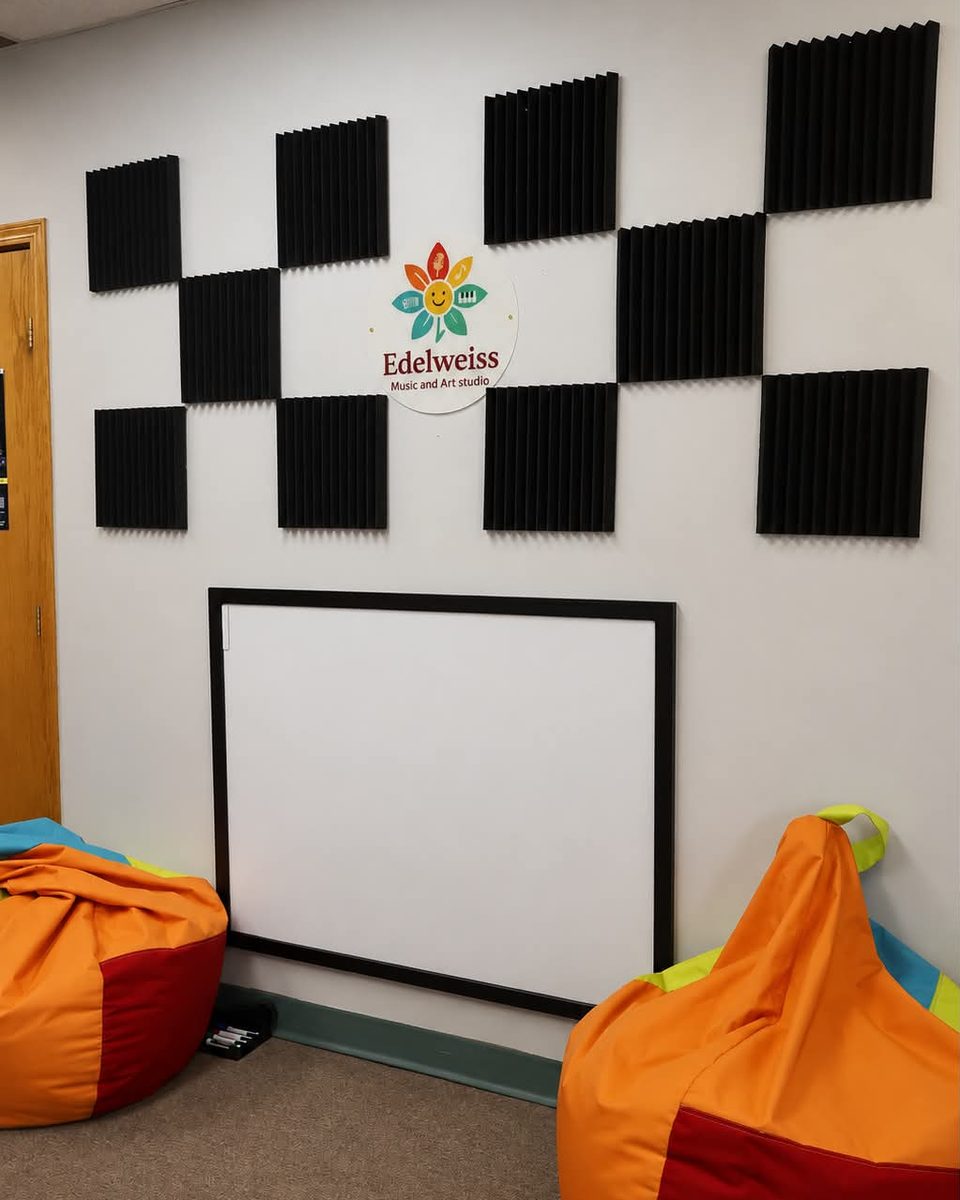 Edelweiss studio teaching room with acoustic wall treatment and seating.