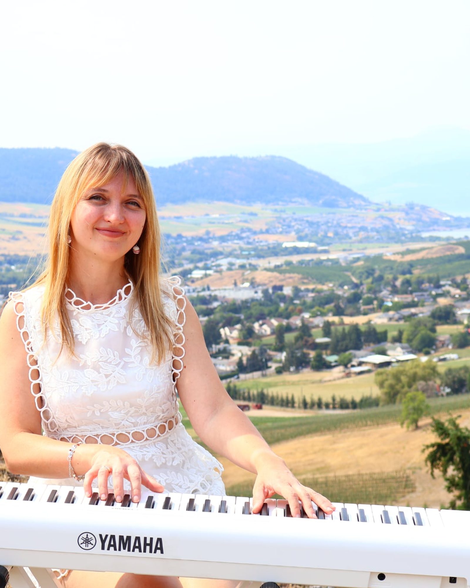 Iryna Viriasova at a Yamaha keyboard overlooking Vernon, British Columbia.