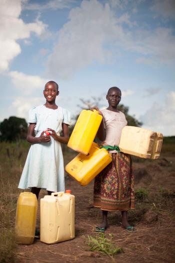 Children carrying water containers
