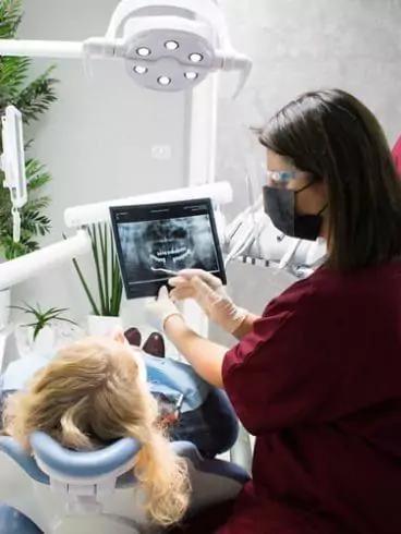 Photo of two doctors performing a dental procedure in Vena Dental Clinic