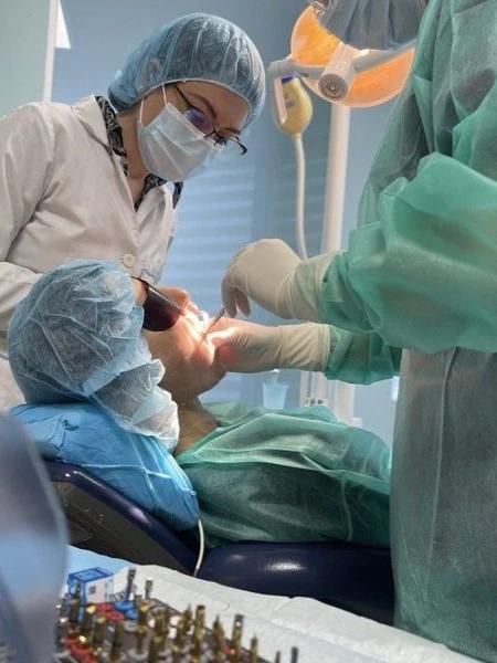 Photo of doctors working on a dental procedure in Max Dent Clinic