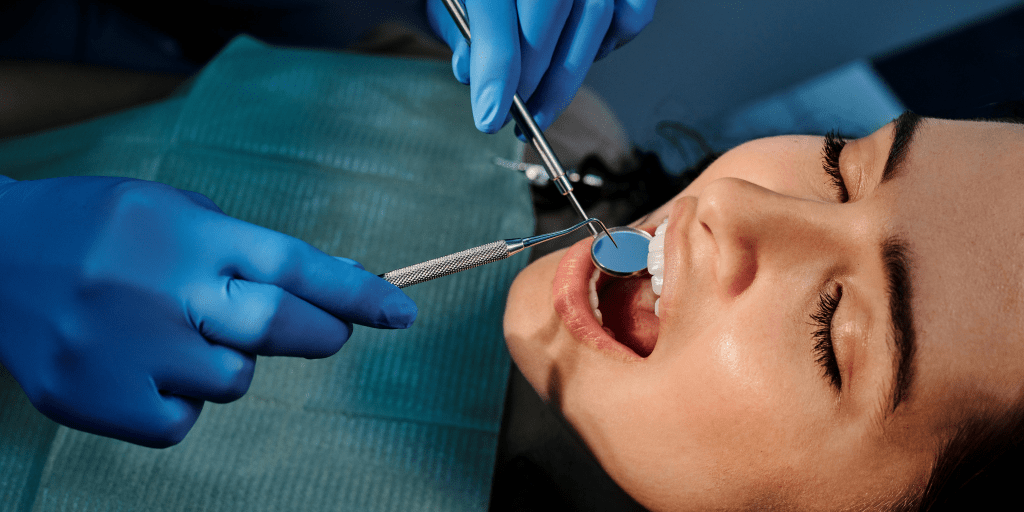 Girl receiving dental treatment at a clinic - Dental Health Awareness blog 