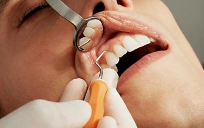 Girl getting periodontics treatment