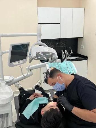 Doctor performing a checkup in Arion Dental Care