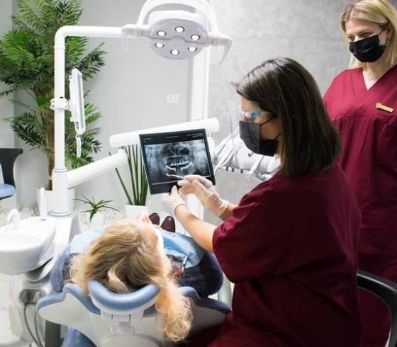 Photo of two doctors performing a dental procedure in Vena Dental Clinic