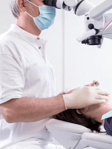 Photo of doctor performing a dental checkup at Ivory Dental Clinic