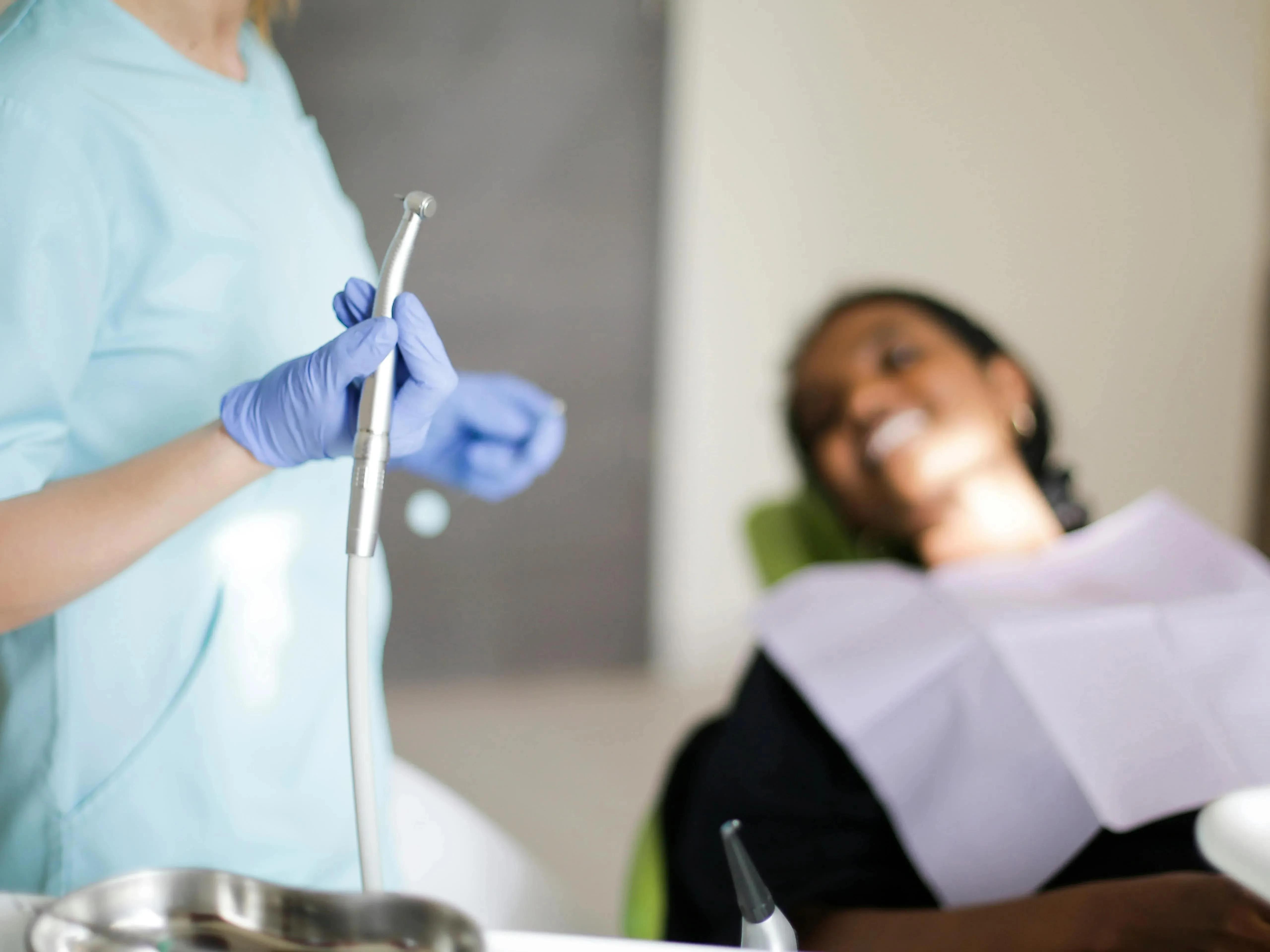 Girl receiving dental treatment-dental veneers and crowns comparison 