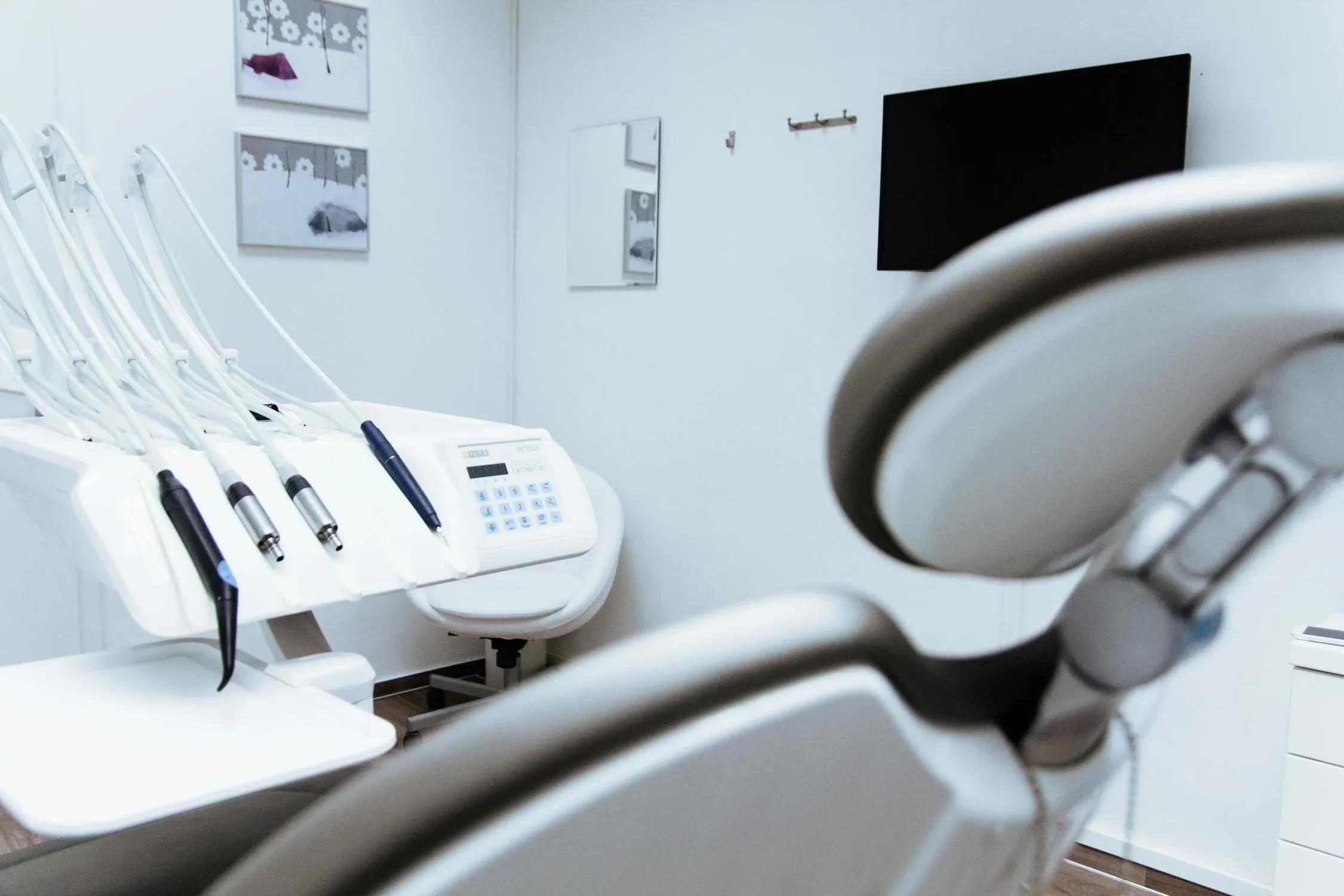 Image of a dental chair and equipment.