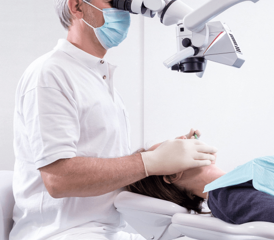 Photo of doctor performing a dental checkup at Ivory Dental Clinic