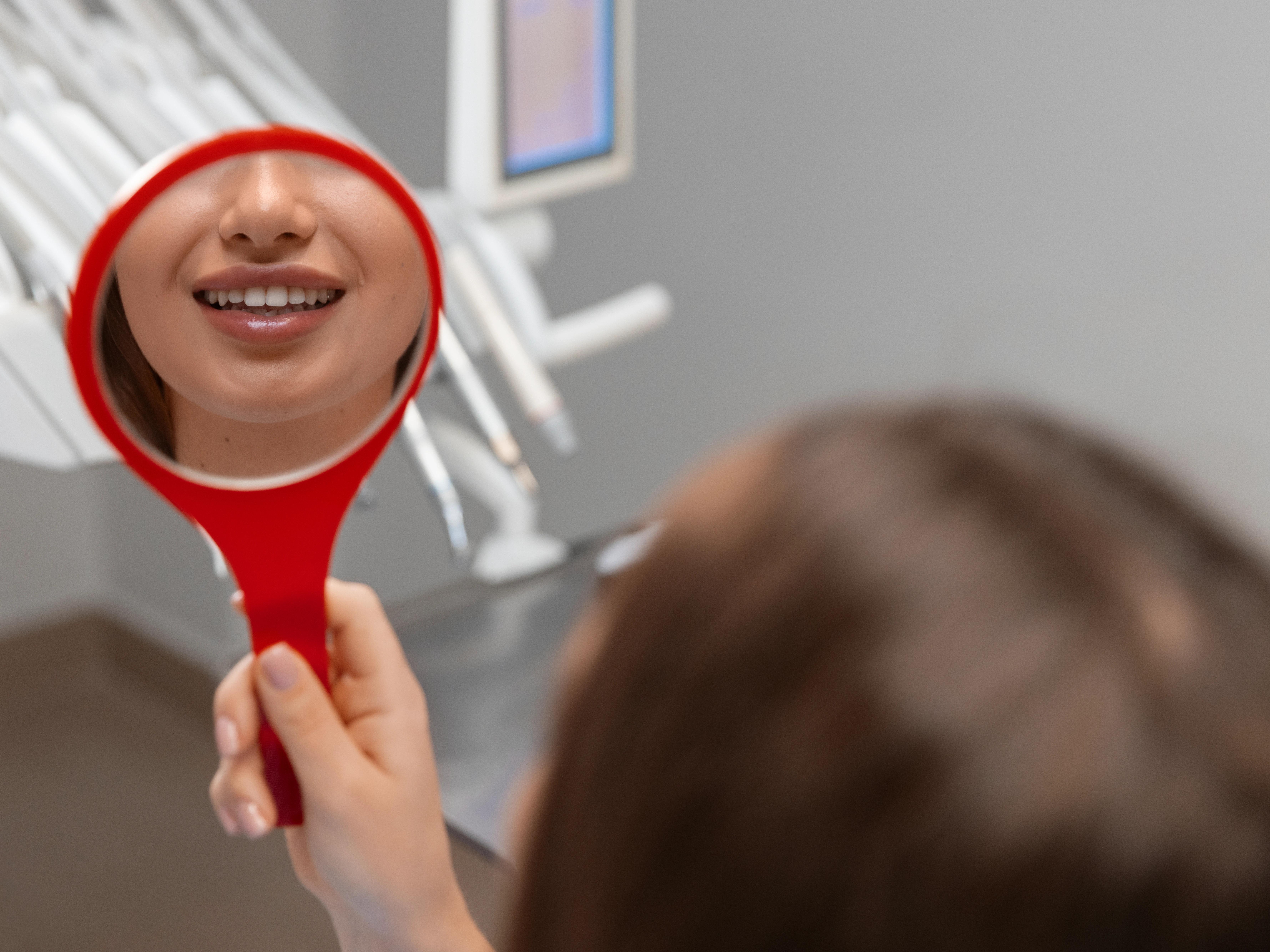 close up dentist using instruments