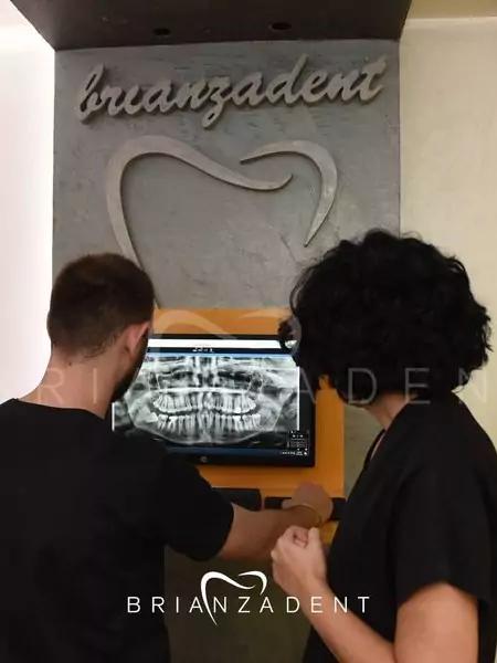 Photo of two doctors examining a dental x-ray scan