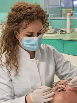 Photo of doctor performing a dental procedure