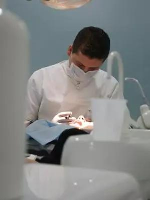 Doctor performing a dental procedure in Eurodent clinic