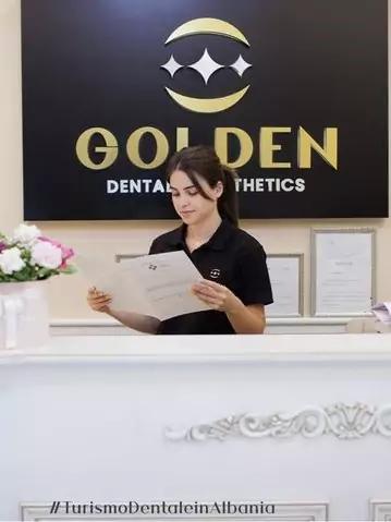 Photo of woman at reception desk at Golden Dental & Aesthetics Clinic