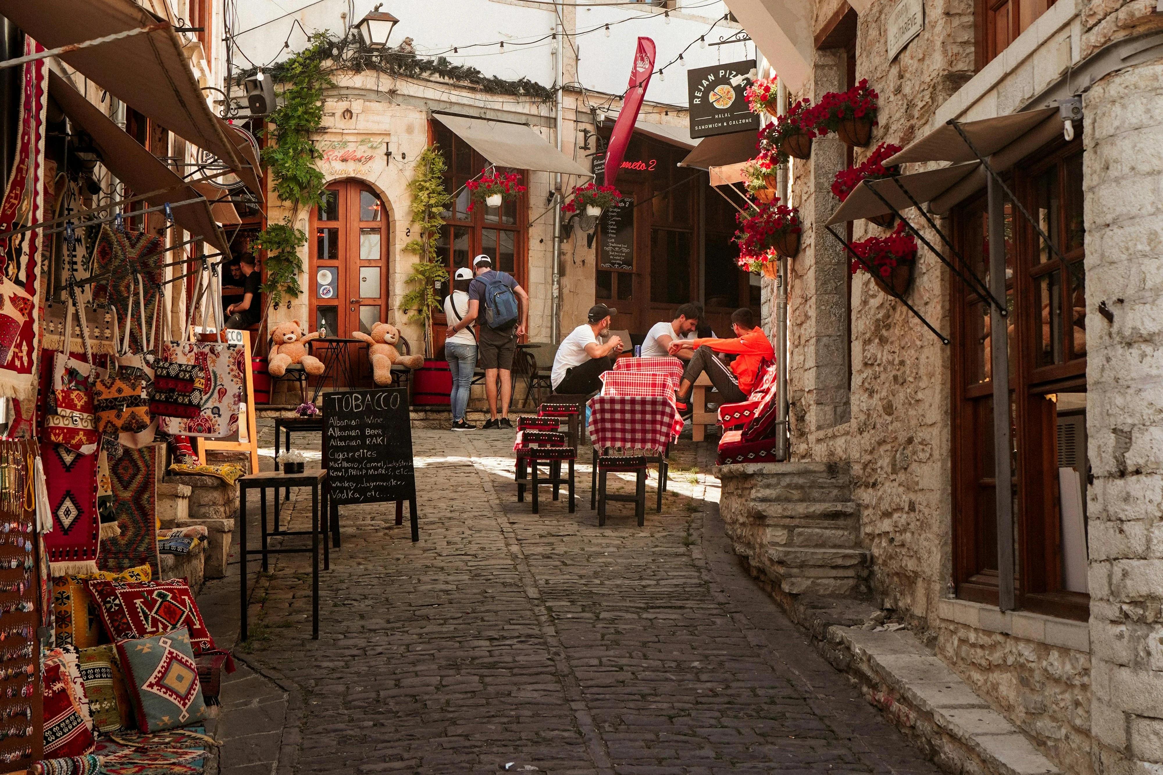 Street in Gjirokastër lined with souvenir shops