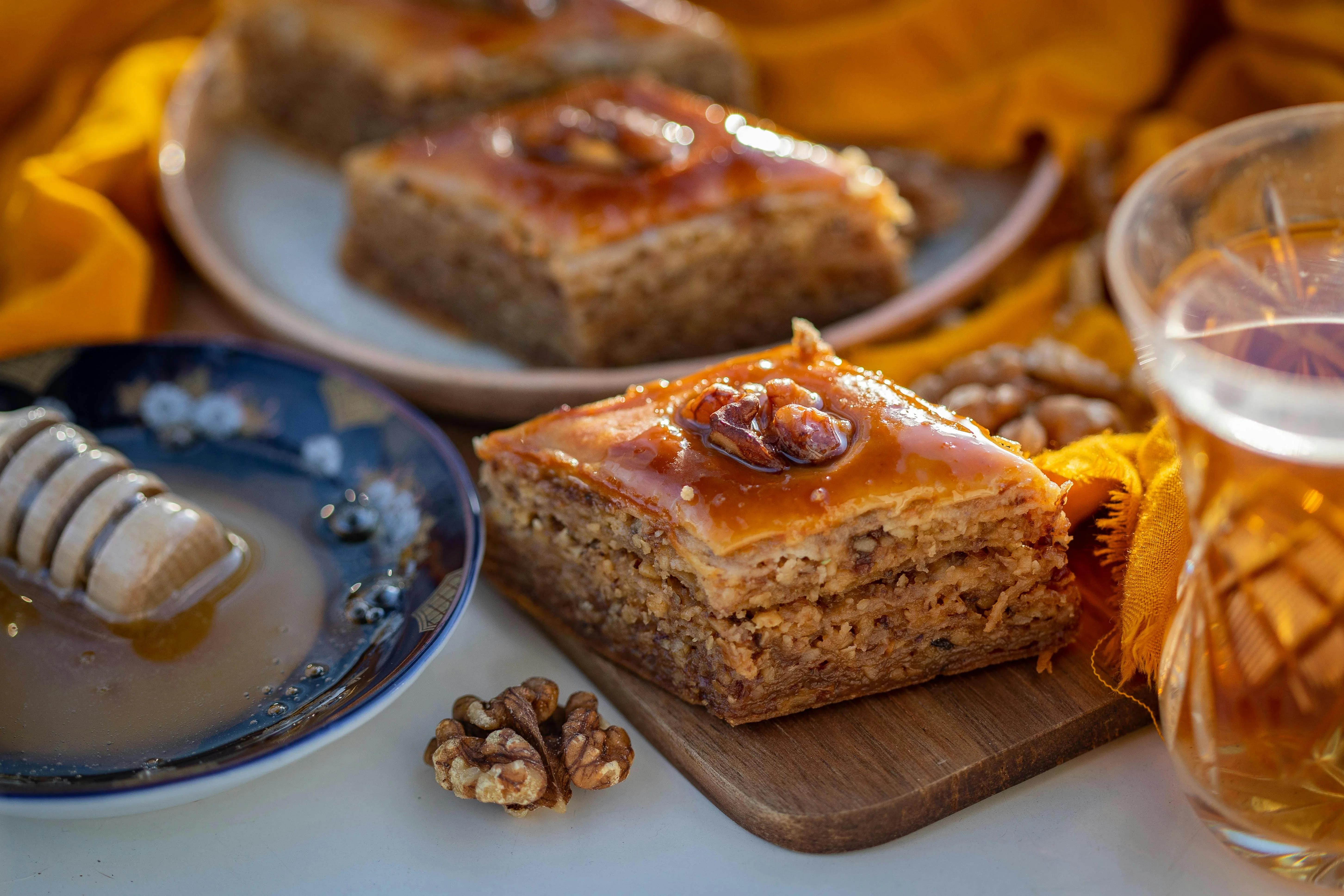 A table with baklava and honey