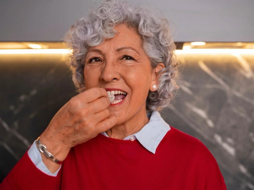 Woman with dentures smiling.