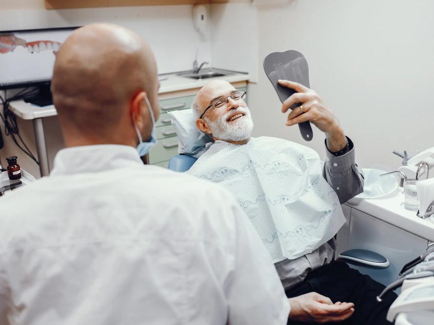 Man at dental clinic smiling