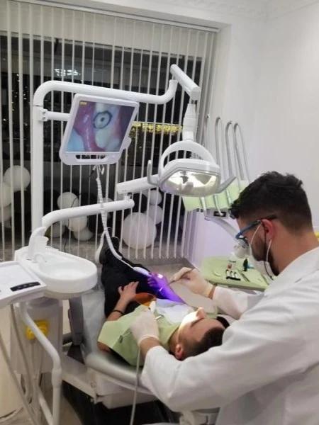 Photo of doctor performing a dental procedure in Dental Clinic Luxury Smile