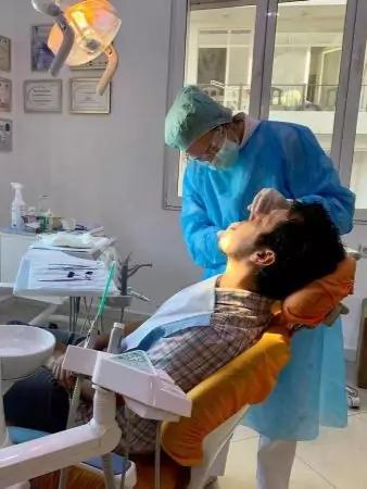 Photo of doctor performing a dental procedure in Albana Dental Studio