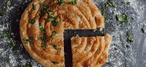 Traditional Albanian pie served as part of a culinary journey through Albania's traditional foods