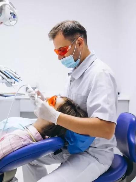 Photo of doctor performing a dental procedure in Prival Clinic