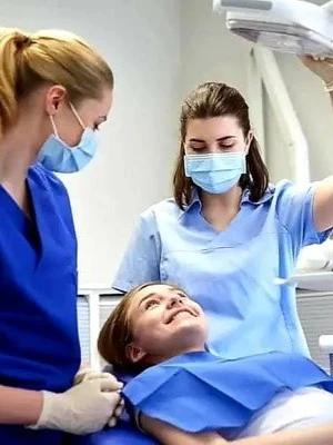 Two doctors performing a dental procedure in Mat Dental Clinic