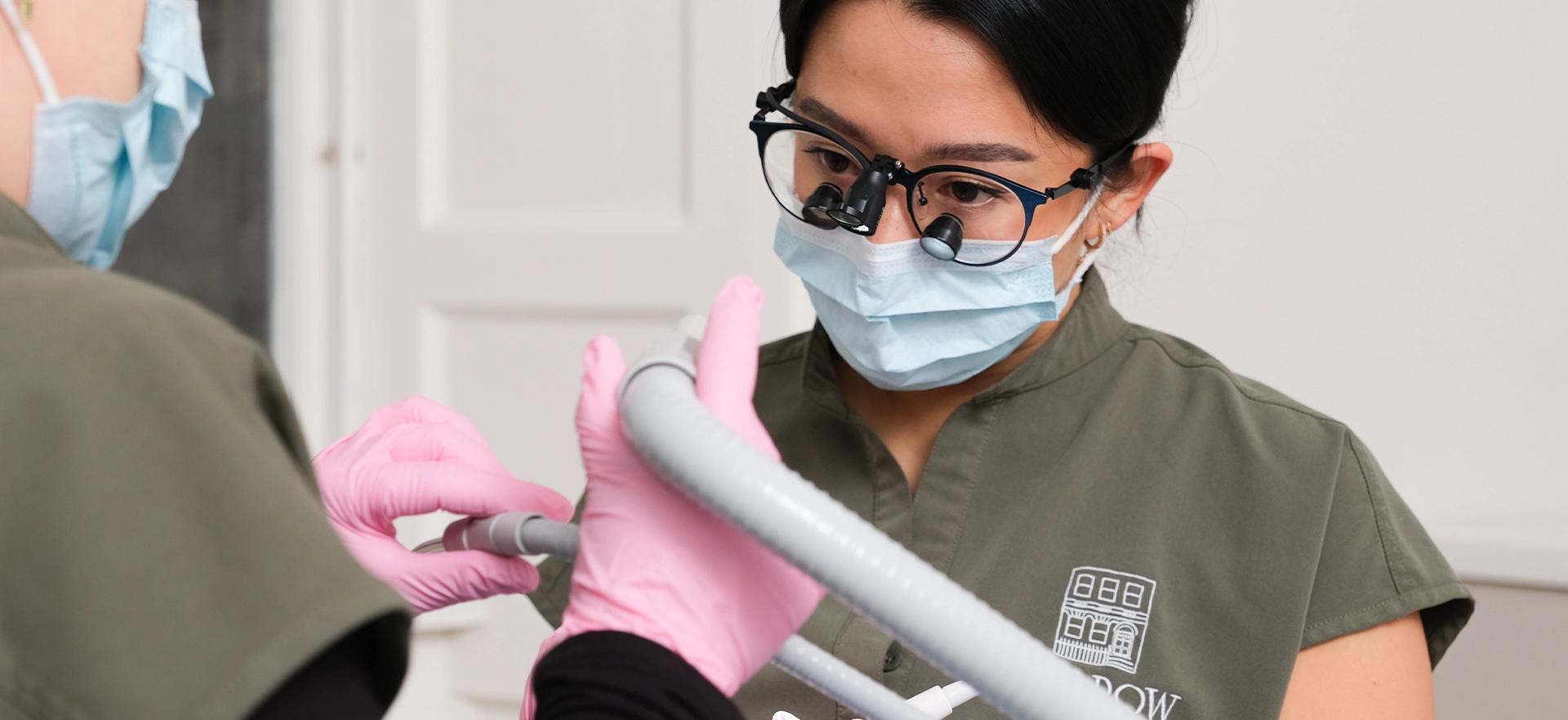 Dentist performing a dental procedure on a patient in a clinic setting