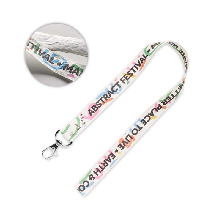 A seed paper lanyard with an example print and a metal hook.