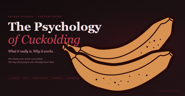 Dark editorial header image for the Second Banana cuckolding psychology guide, burgundy and rose palette. A near-black background with a deep red rule across the top. Left column reads "The Psychology of Cuckolding" across two lines in dusty rose-white and rose italic serif type, with the subtitle "What it really is. Why it works." and the tagline "The shame was never warranted. The tags find people who already know that." Tag pills along the bottom left read Cuckold, Bull, Humiliation, Chastity, Aftercare in deep rose. A banana illustration in warm rose-red tones lies diagonally across the right side. Second Banana branding lower right.