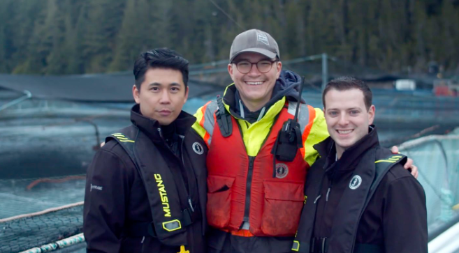 A salmon farm crew working on the water off the coast of British Columbia.