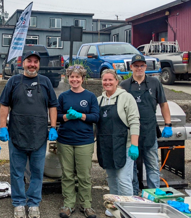 Young Salmon Farmers of B.C. volunteering at a beach clean-up and eelgrass restoration in a coastal community.