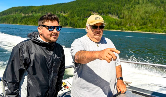 A First Nations Guardian Watchman on a small boat monitoring coastal waters in British Columbia.