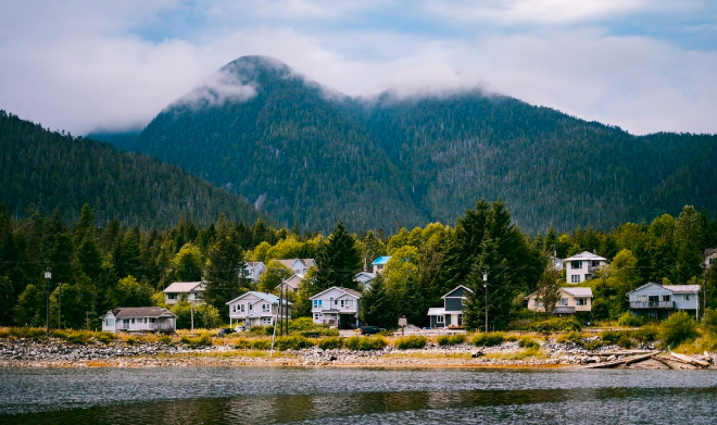 A B.C. coastal community with salmon farming infrastructure visible on the water.