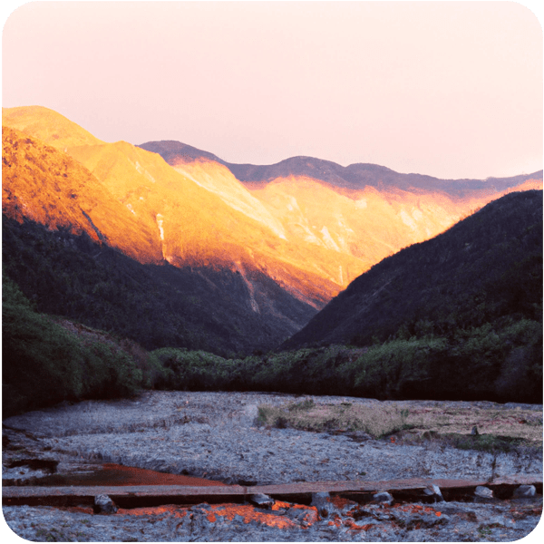 The landscape of Tyume Valley seen in golden hour lighting, 35mm
