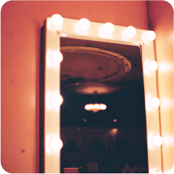 Close up of a dressing room mirror backstage at a grand theatre, 35mm