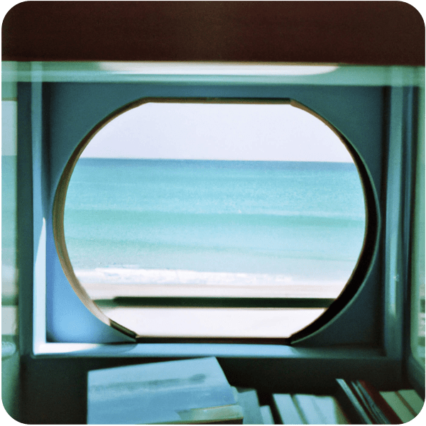 A memory of clear, blue sea seen through a small window in a library 