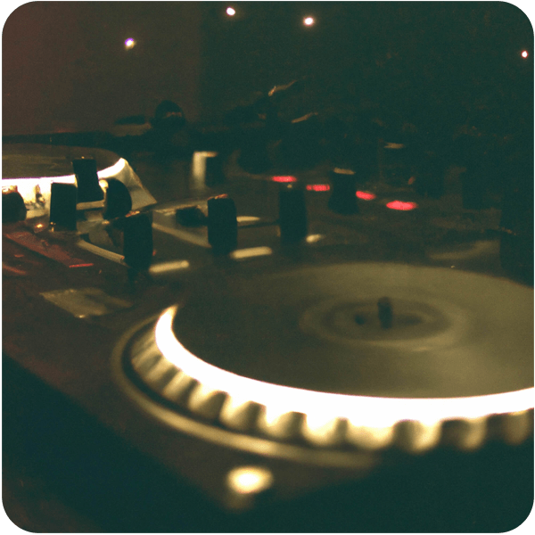 Close up of a DJ deck seen in a nostalgic glow, 35mm 