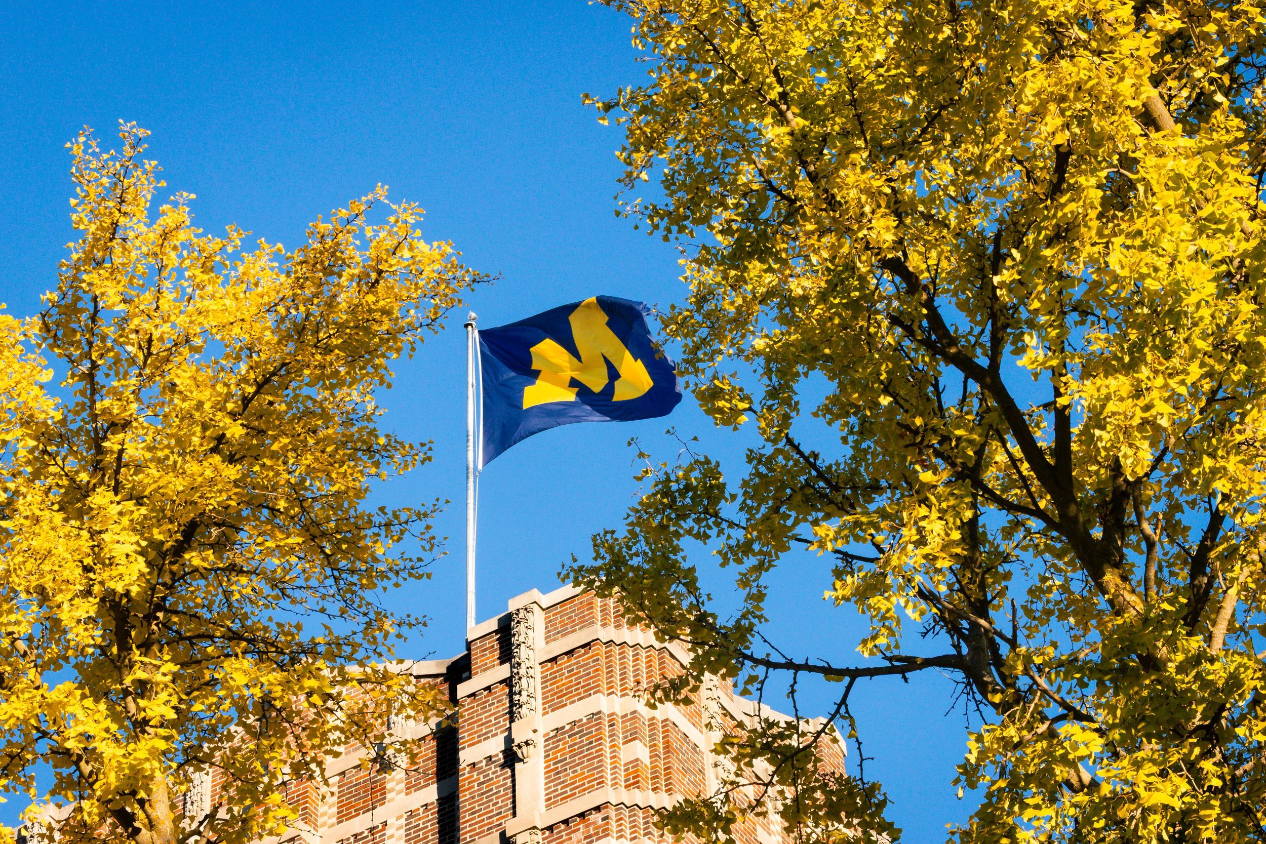 The block M flag flying on the roof of the Michigan Union