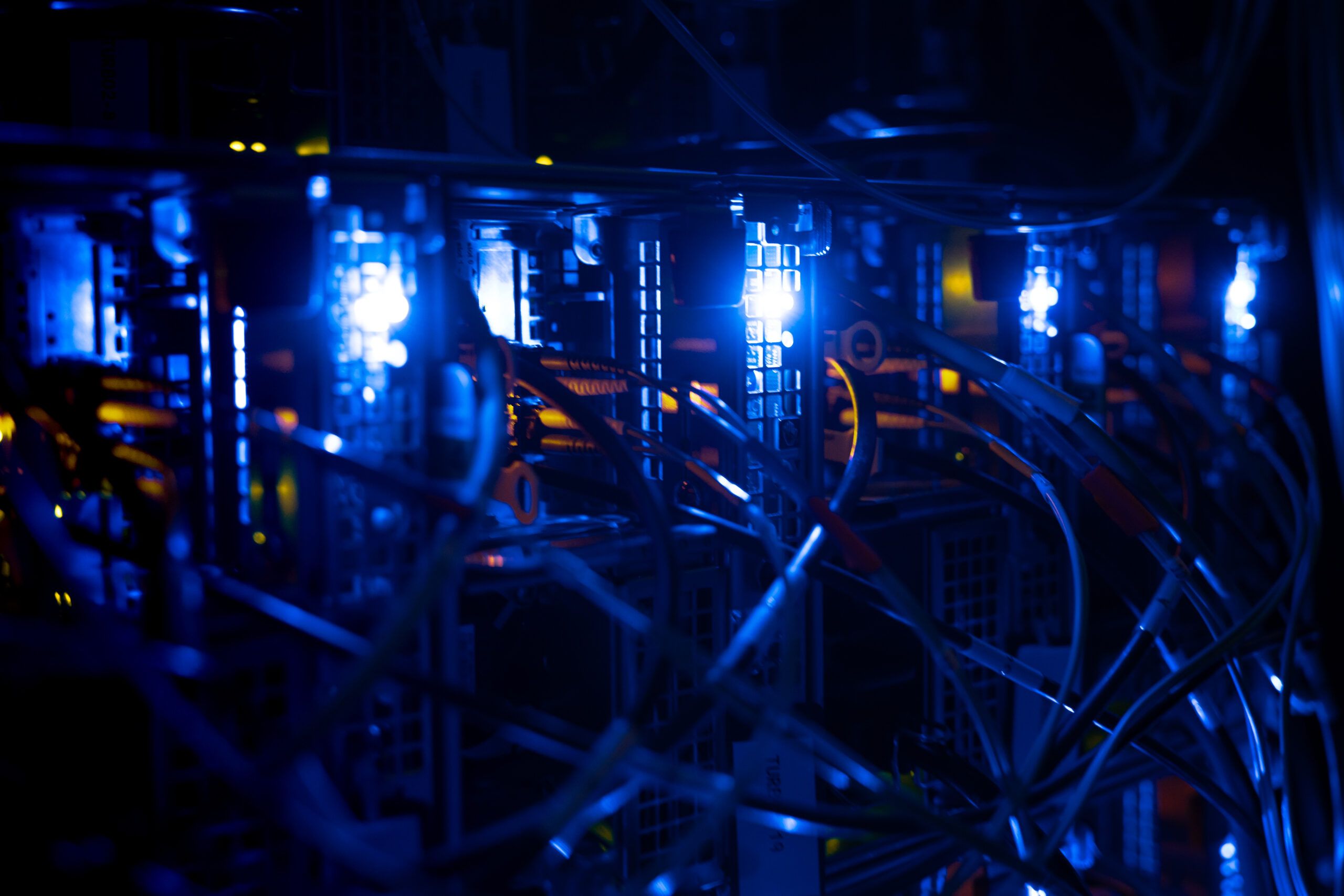 Equipment in the dark with blue lights illuminated on it