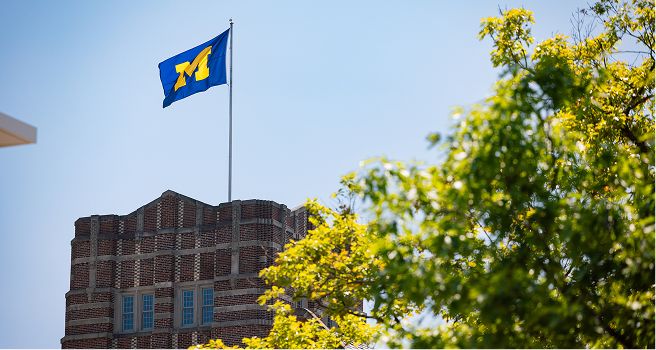 The block M flag flying at the top of the Michigan Union