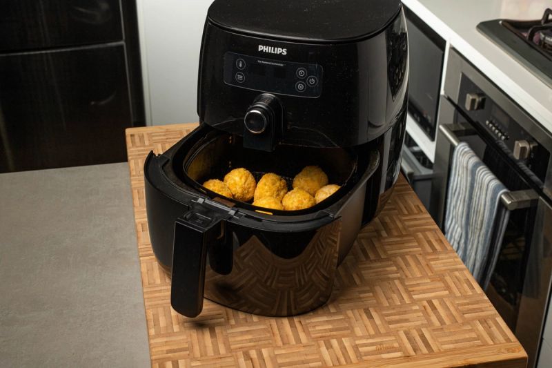 Air fryer with chicken balls in the basket