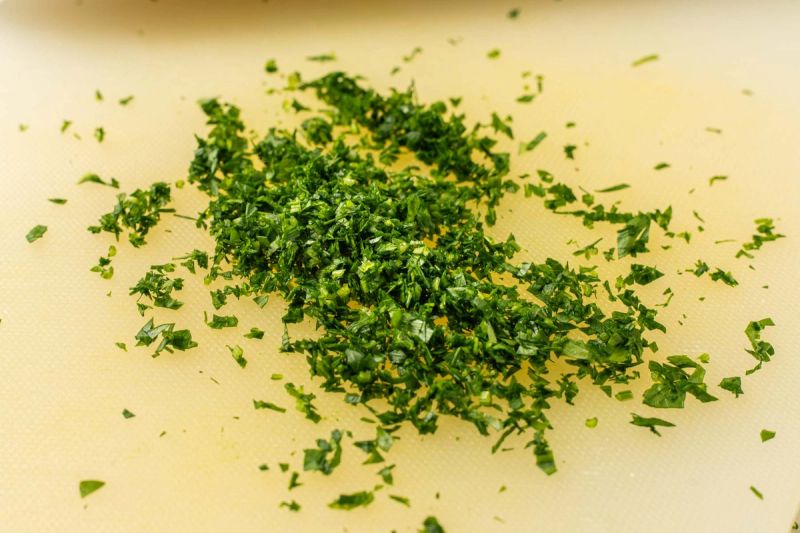 Freshy parsley chopped on cutting board Freshy parsley chopped on cutting board
